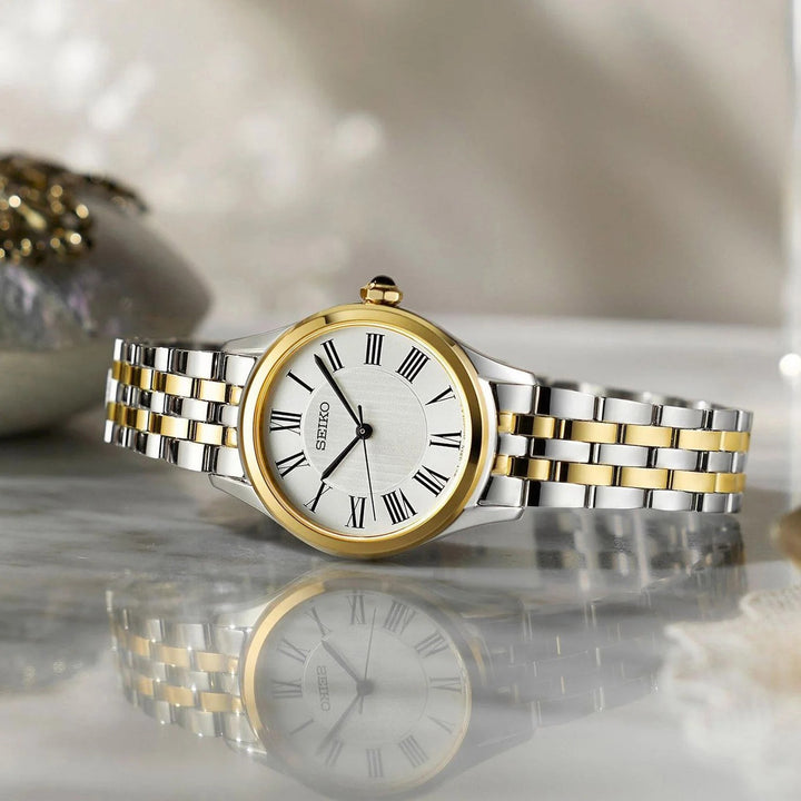SEIKO LADIES QUARTZ WATCH – 29.6MM WHITE ROMAN NUMERAL DIAL SAPPHIRE CRYSTAL TWO-TONE STEEL BRACELET